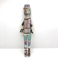 Colorfully Painted Folk Art Carved Wooden Figure with Cloth Covered Wire Arms