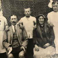 Striking Antique RPPC Family Portrait in Front of Woven Textile