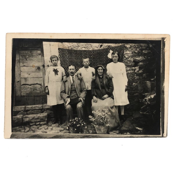 Striking Antique RPPC Family Portrait in Front of Woven Textile