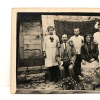 Striking Antique RPPC Family Portrait in Front of Woven Textile