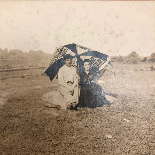 Couple with Advertising Umbrella on Beach Antique Photograph