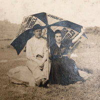 Couple with Advertising Umbrella on Beach Antique Photograph