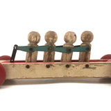 Fabulous 1920s Hustler Toy Co. Rowers in Skull Wooden Push Toy