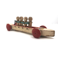 Fabulous 1920s Hustler Toy Co. Rowers in Skull Wooden Push Toy