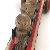 Fabulous 1920s Hustler Toy Co. Rowers in Skull Wooden Push Toy