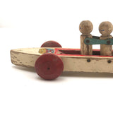 Fabulous 1920s Hustler Toy Co. Rowers in Skull Wooden Push Toy