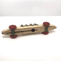 Fabulous 1920s Hustler Toy Co. Rowers in Skull Wooden Push Toy