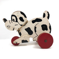 Black and White Dog on Red Wheels Old Wooden Pull Toy