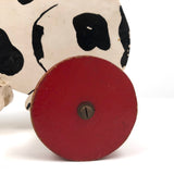 Black and White Dog on Red Wheels Old Wooden Pull Toy