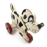Black and White Dog on Red Wheels Old Wooden Pull Toy