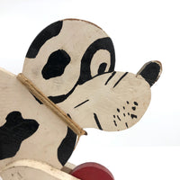 Black and White Dog on Red Wheels Old Wooden Pull Toy