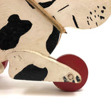 Black and White Dog on Red Wheels Old Wooden Pull Toy