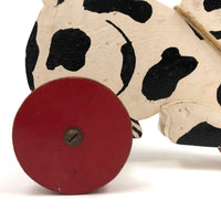 Black and White Dog on Red Wheels Old Wooden Pull Toy