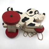 Black and White Dog on Red Wheels Old Wooden Pull Toy
