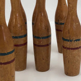 Nine Wooden Toy Skittles Pins With Red and Blue Painted Stripes
