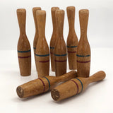 Nine Wooden Toy Skittles Pins With Red and Blue Painted Stripes