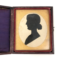 Black and White Cut Paper Silhouettes of Young Woman in Antique Pocket Frame