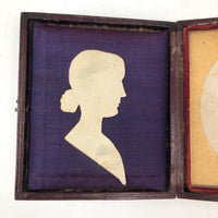 Black and White Cut Paper Silhouettes of Young Woman in Antique Pocket Frame