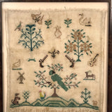 19th Century Needlepoint Sampler with Parrot, Pistols, and Fleur de Lis