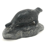 Inuit Carved Stone Seal on Rock