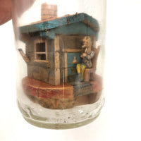 Amazing House in a Bottle Whimsy with Man Smoking Cigar and Two People Inside!