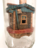 Amazing House in a Bottle Whimsy with Man Smoking Cigar and Two People Inside!