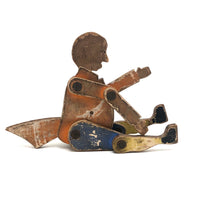 Another Jointed Wooden Man in Orange Top Coat with Wing-like Tails