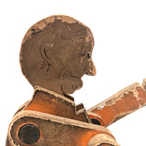 Another Jointed Wooden Man in Orange Top Coat with Wing-like Tails