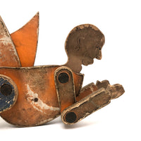 Another Jointed Wooden Man in Orange Top Coat with Wing-like Tails