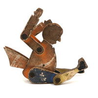 Another Jointed Wooden Man in Orange Top Coat with Wing-like Tails