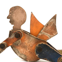Another Jointed Wooden Man in Orange Top Coat with Wing-like Tails