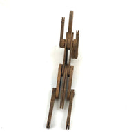 Another Jointed Wooden Man in Orange Top Coat with Wing-like Tails