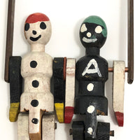 Black and White Pair of Jointed Wooden Figures on Hanger