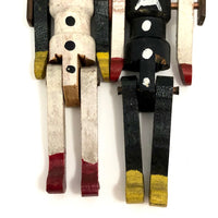 Black and White Pair of Jointed Wooden Figures on Hanger