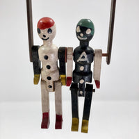 Black and White Pair of Jointed Wooden Figures on Hanger