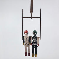 Black and White Pair of Jointed Wooden Figures on Hanger