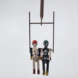 Black and White Pair of Jointed Wooden Figures on Hanger