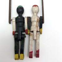 Black and White Pair of Jointed Wooden Figures on Hanger