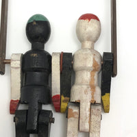 Black and White Pair of Jointed Wooden Figures on Hanger