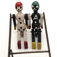 Black and White Pair of Jointed Wooden Figures on Hanger