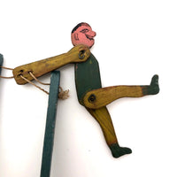 Colorful Old Wooden Acrobat Squeeze Toy on Stand