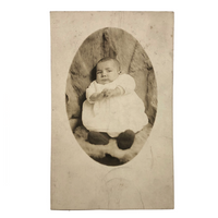 Wary Looking Baby on Fur,  Real Photo Postcard