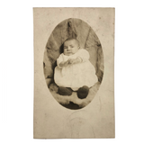 Wary Looking Baby on Fur,  Real Photo Postcard