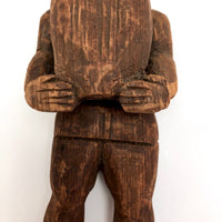 Carved Wooden Man Holding Barrel