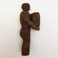 Carved Wooden Man Holding Barrel