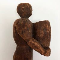 Carved Wooden Man Holding Barrel